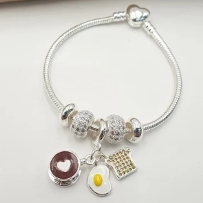 PULSERA MULTICHARMS PLATEADA