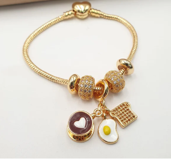 PULSERA MULTICHARMS DORADO