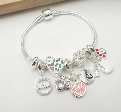 PULSERA MULTICHARMS PLATEADA