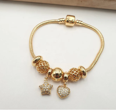 PULSERA MULTICHARMS DORADO